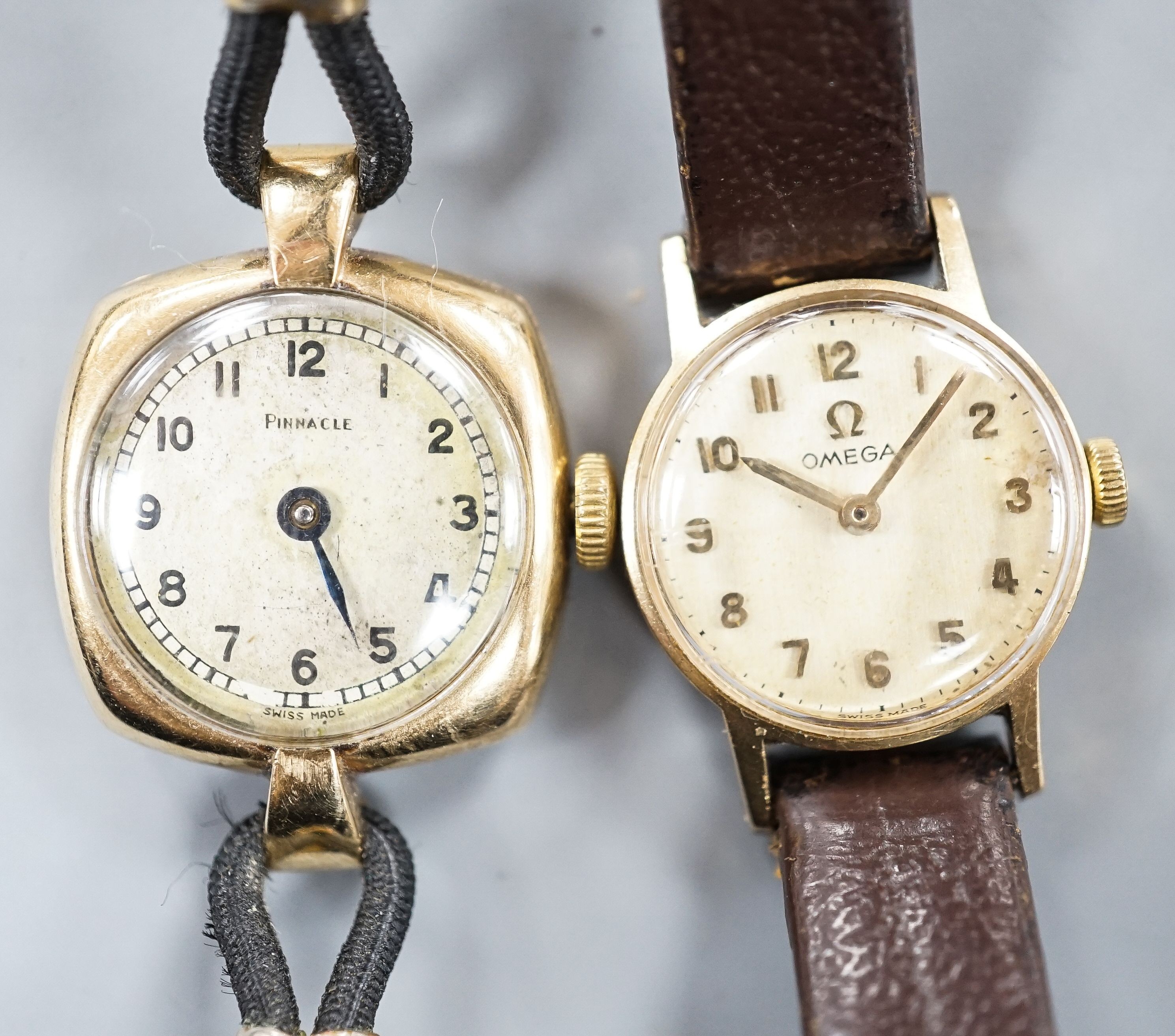 A lady's yellow metal Omega manual wind wrist watch, on leather strap and a similar 9ct Pinnacle watch.